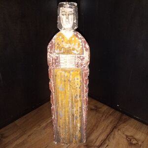 Rustic Wooden Figurine with Yellow and Red Accents